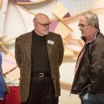 Two men chatting with each other at the reception